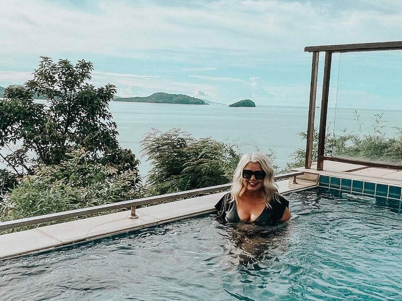 woman relaxing in a pool in phuket thailand. 