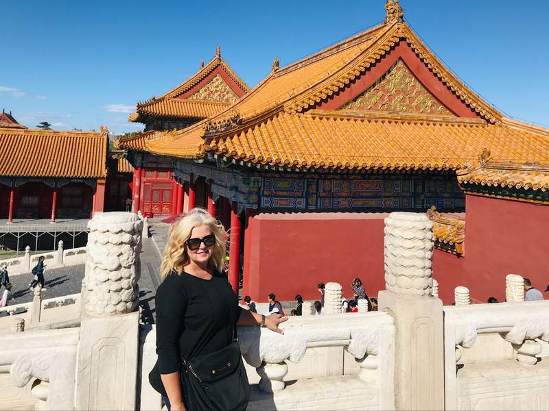 a woman visiting the Forbidden City in Beijing China.
