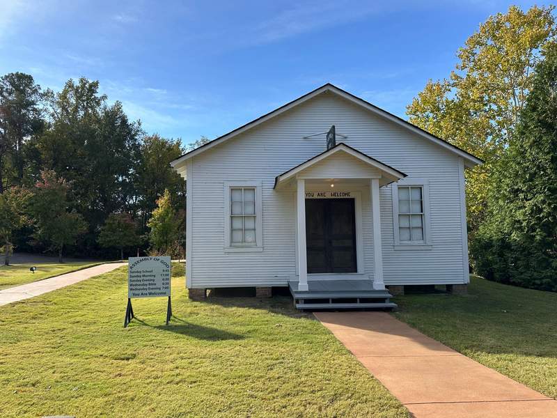 A small white wooden church building at the Elvis Presley Birthplace.