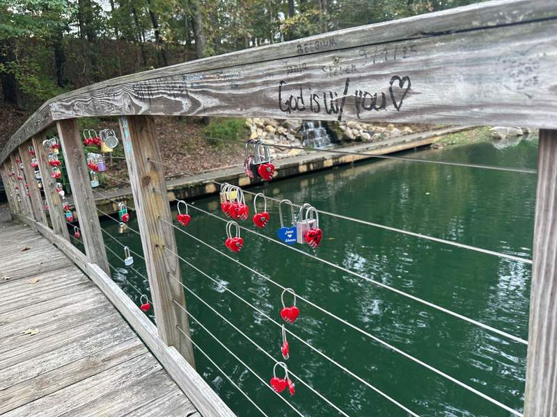 A bridge with numerous locks, many heartshaped.