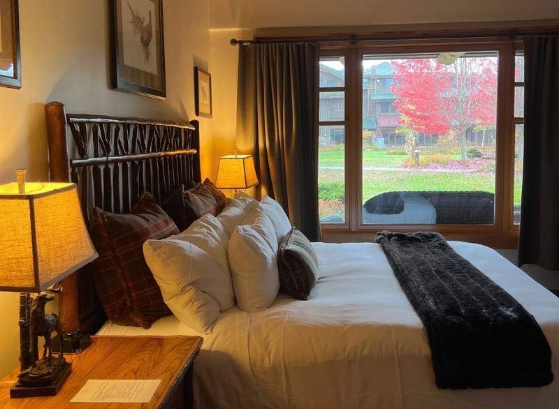 The Whiteface Lodge suites have all the comforts of home, including plush bedding and foliage views.