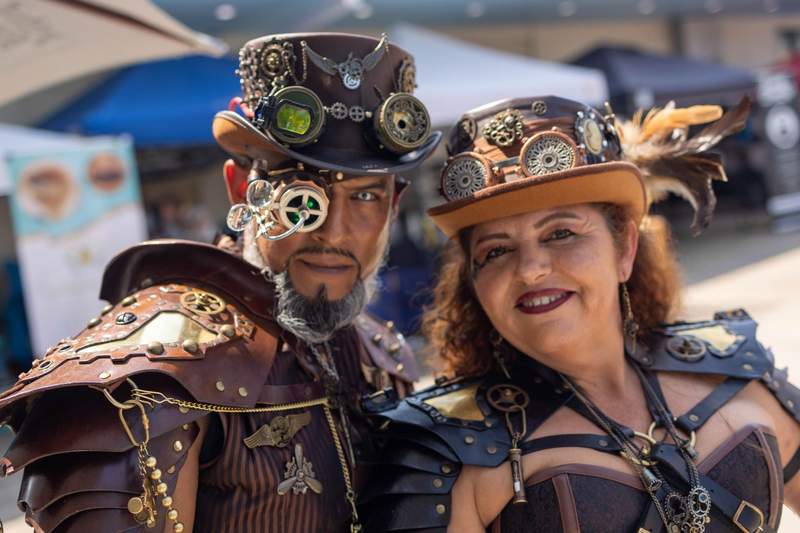 A man and woman dressed in steampunk attire. 