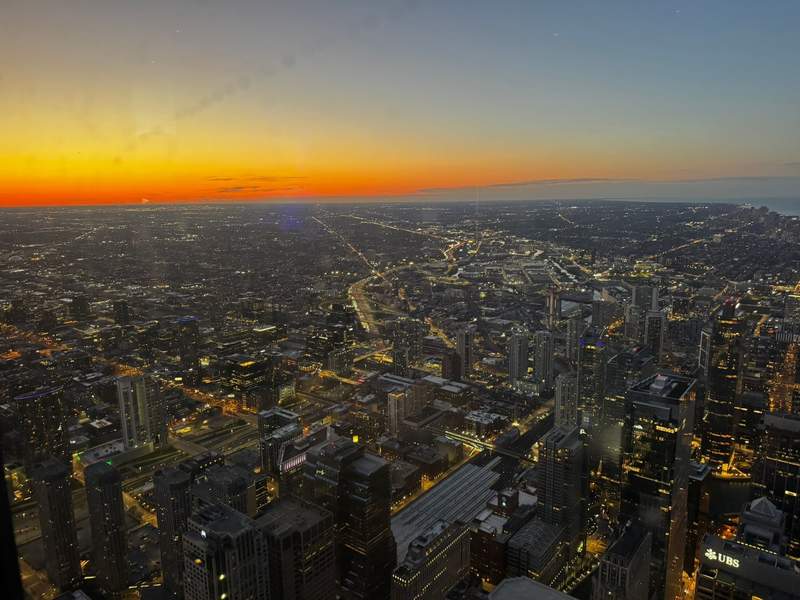 Skydeck Chicago just before sunset, with warm light over the city skyline.