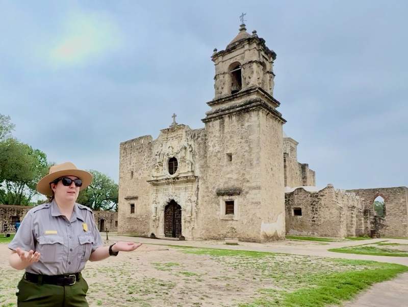 Park ranger standing in front of Mission San Jose Church