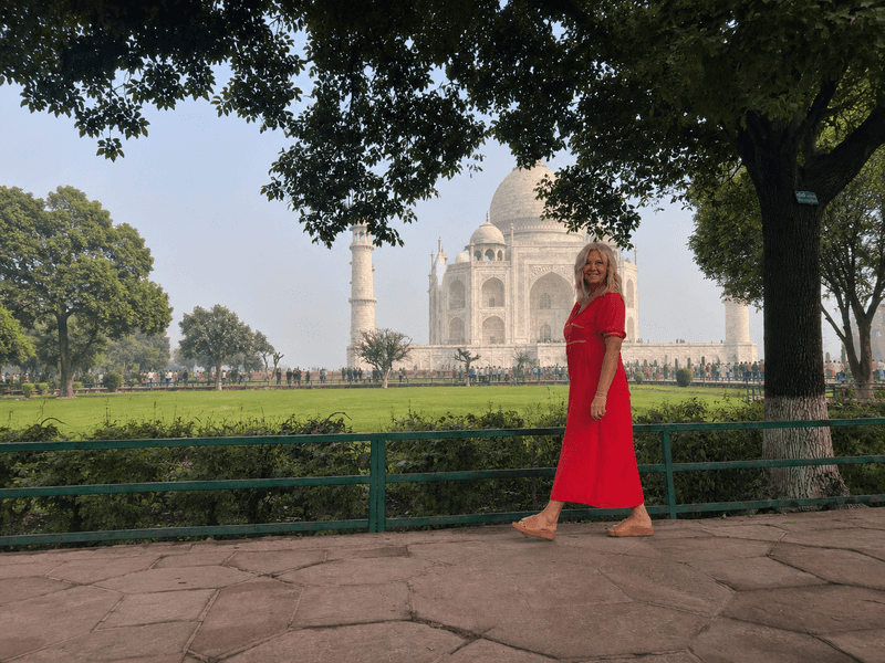 Woman walking through the gardens at the Taj Mahal
