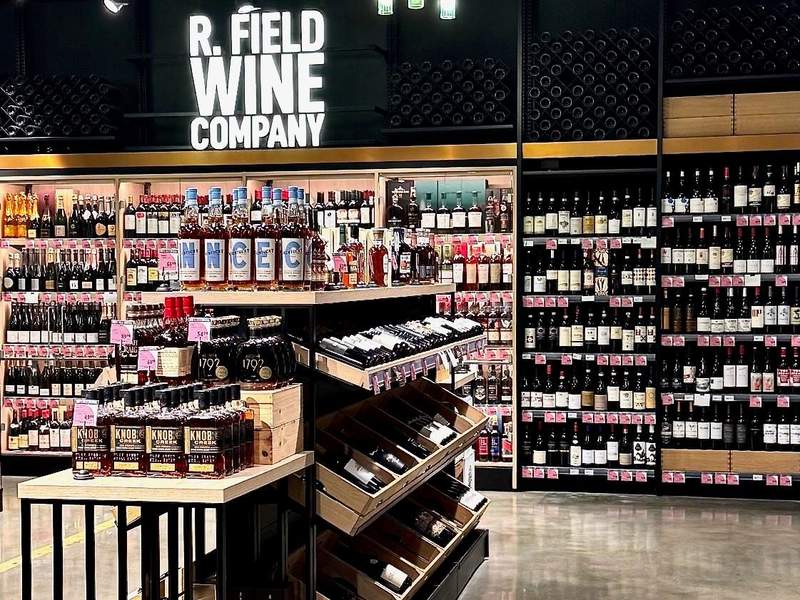 Huge selection of wines and spirits on shelves at R. Field Wine Company at Foodland Farms.