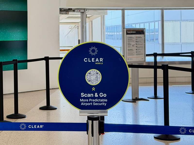 Blue CLEAR sign designating where to line up at the airport. Photo credit: Kim Orlando