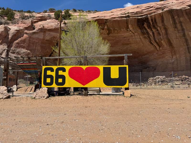 A brightly colored sign welcomes drivers to Arizona on Route 66.