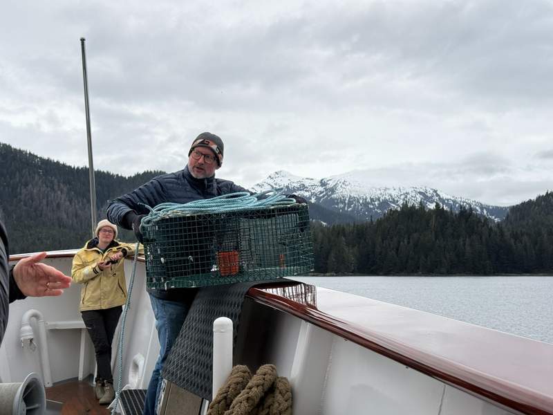 Man holding a shrimp pot