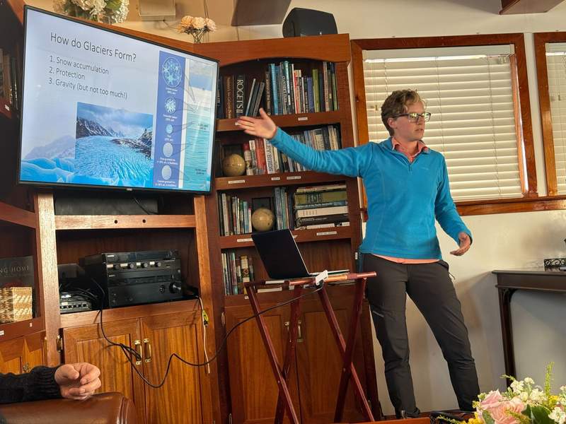 Woman pointing to a screen