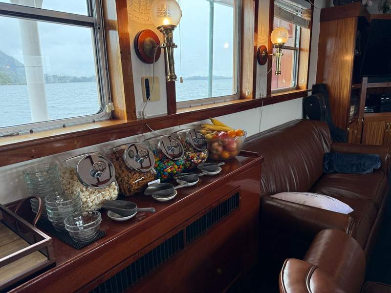 Several hars of snacks on a shelf aboard The Boat Company's small ship
