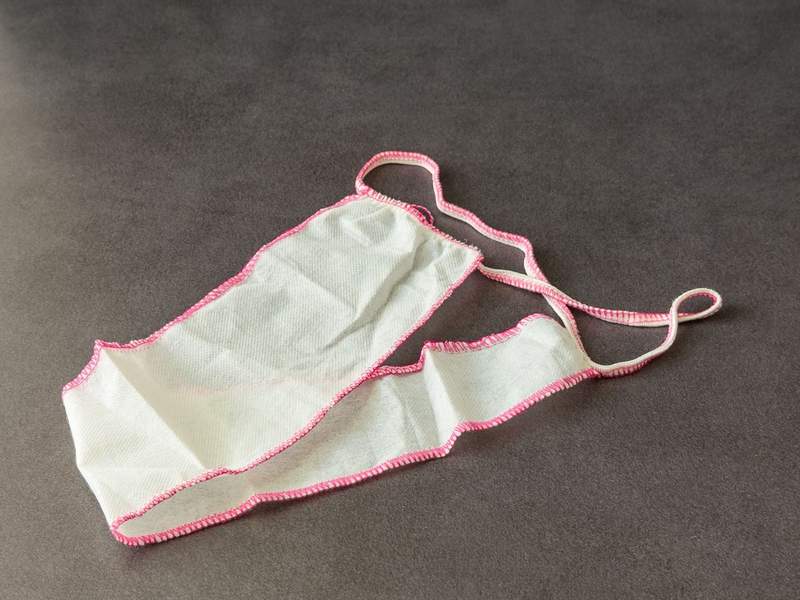 A white and pink disposable panties.