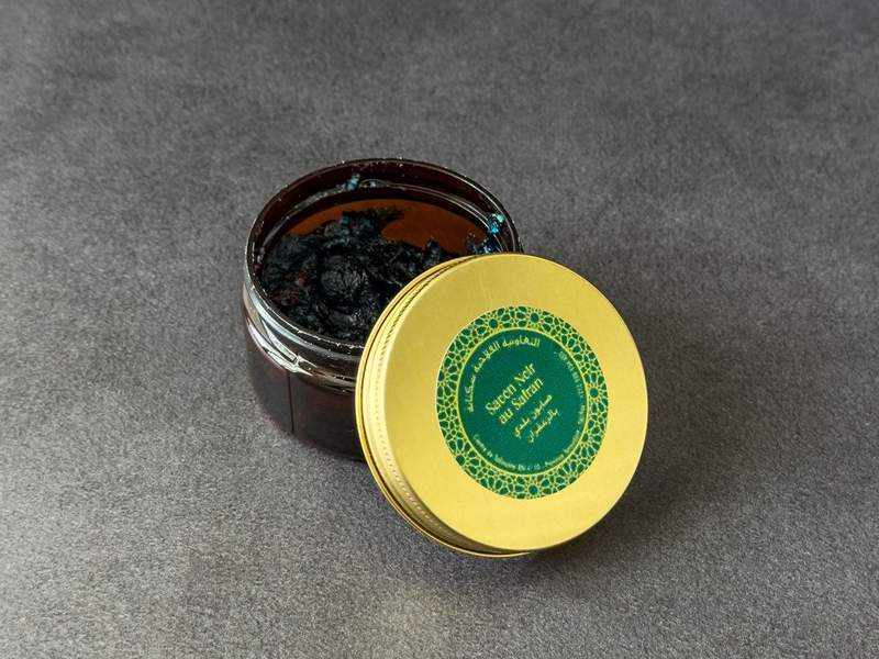 A jar of black soap used in a traditional hammam.