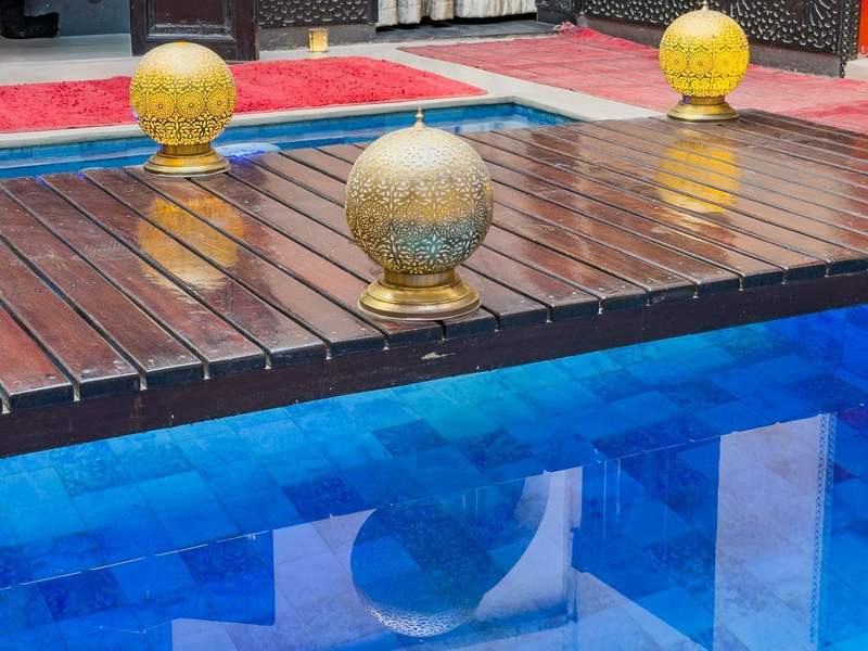 A pool with gold balls on top
