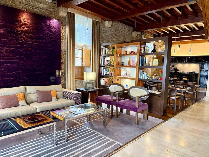 A calm and luxurious boutique hotel lobby.