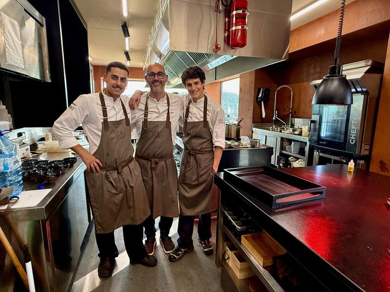 Two generations of family chefs pose in the kitchen of Michelin-starred Vértigo Restaurante