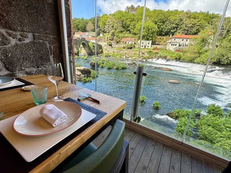 View of the beautiful town of Ponte Maceira from the dining room of the Restaurante Ponte Maceira.