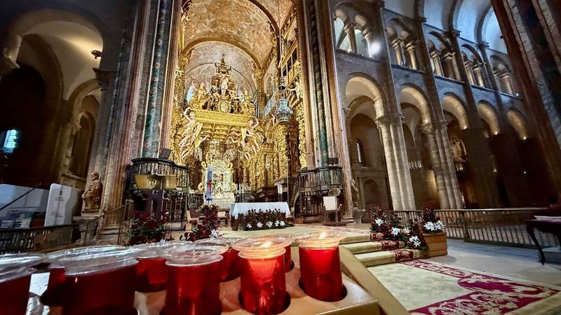An elegant golden altar inside the Cathedral of Santiago de Compostela.