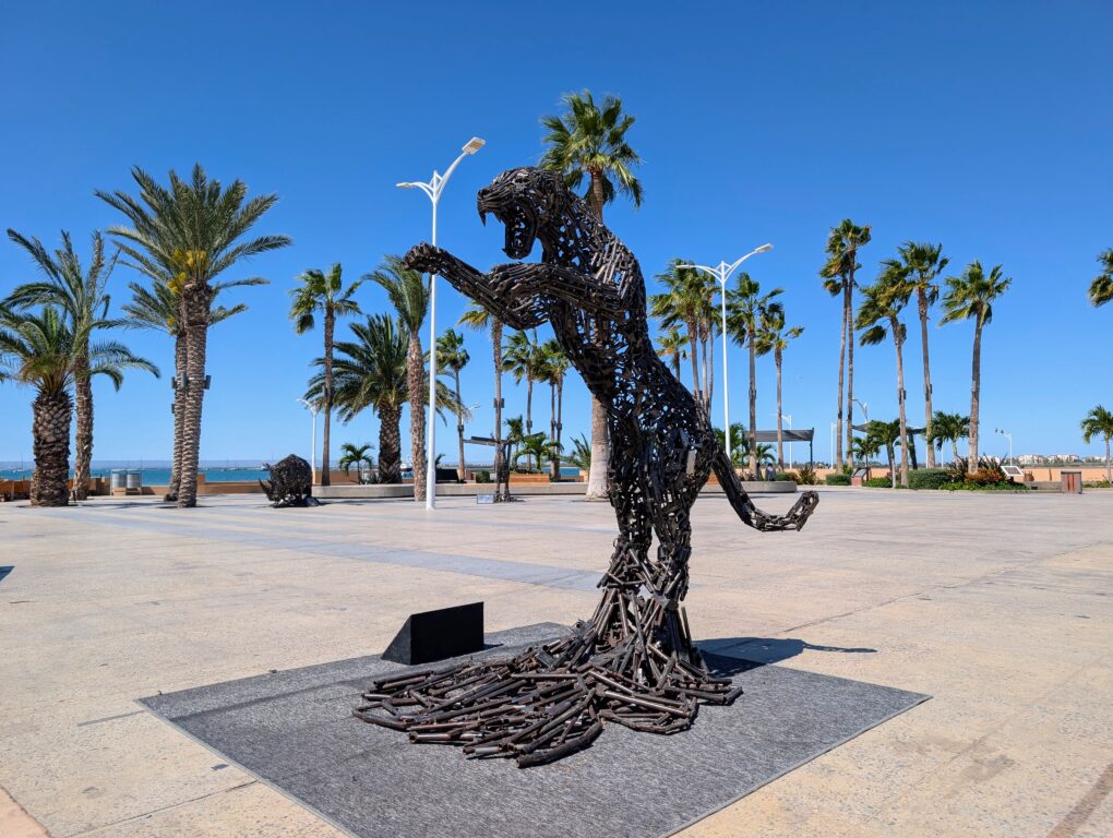A lion statue on the Malecon waterfront walkway in La Paz Mexico