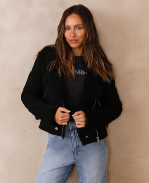 Model wearing a black jacket from Fortunate One