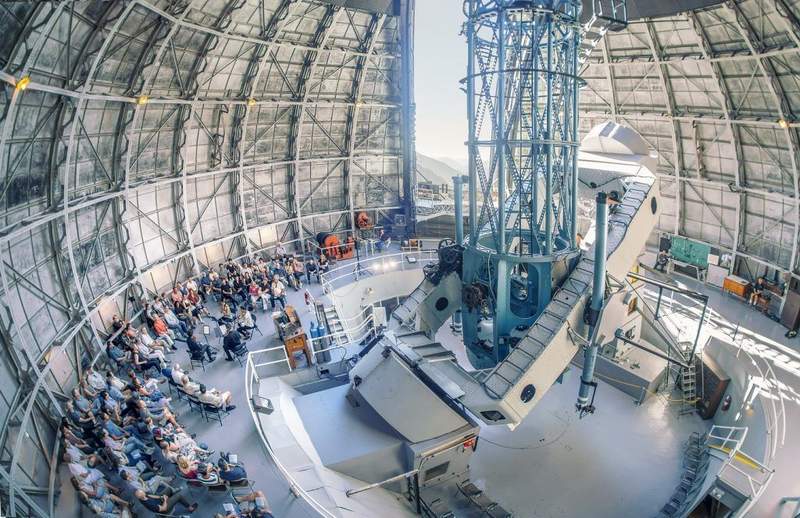 Interior of the Mount Wilson Observatory with concert band set up to play.