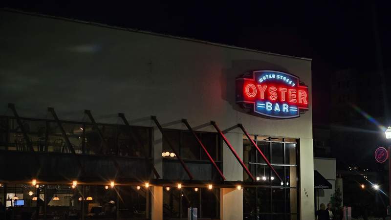 The neon lights of the water street oyster bar at night 