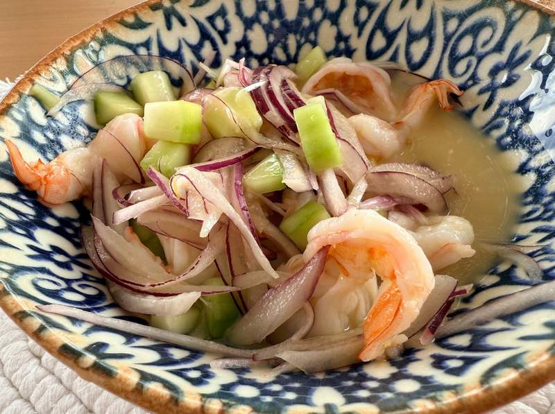 A vibrant, freshly prepared local ceviche served in a rustic bowl, capturing the authentic essence of Mexican hospitality.shrimp ceviche in bowl