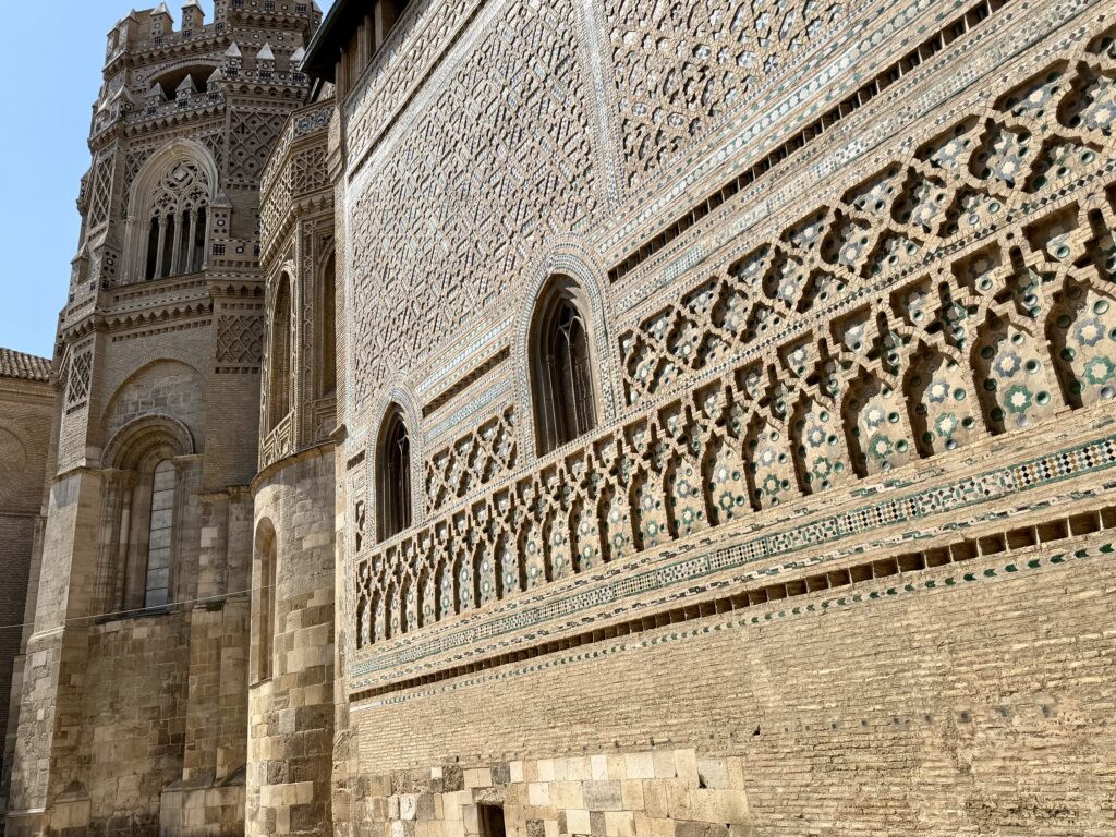 Brick exterior of La Seo in Zaragoza, Spain, a UNESCO example of Mudejar architecture.