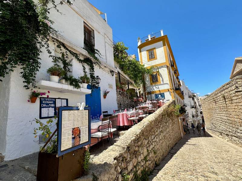 Looking down a narrow street at Can D’en Parra’s patio.