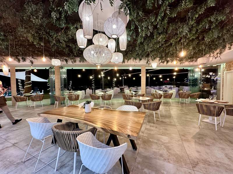 Elegant dining room overlooking a pool area.