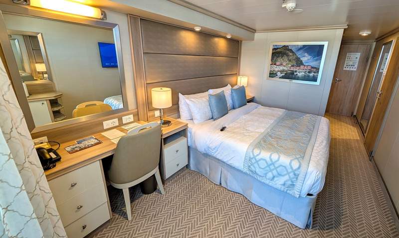 A balcony cabin on board the Enchanted Princess cruise ship