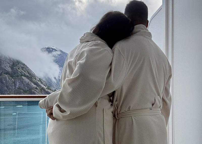 On our balcony in cozy robes, taking in the icy views of Endicott Arm