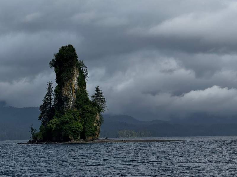 View of New Eddystone Rock volcanic spire on a boat tour through Misty Fjords and Wilderness Explorer Cruise near Ketchikan.