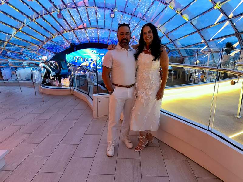 Dressed in white for an evening aboard Star Princess, with the candlelit concert setting in the background.
