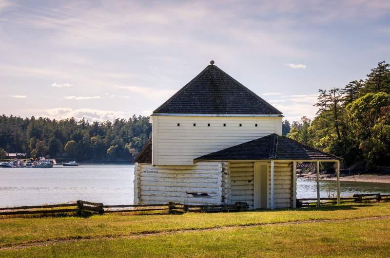 The blockhouse stands at the edge of the parade ground at English Camp