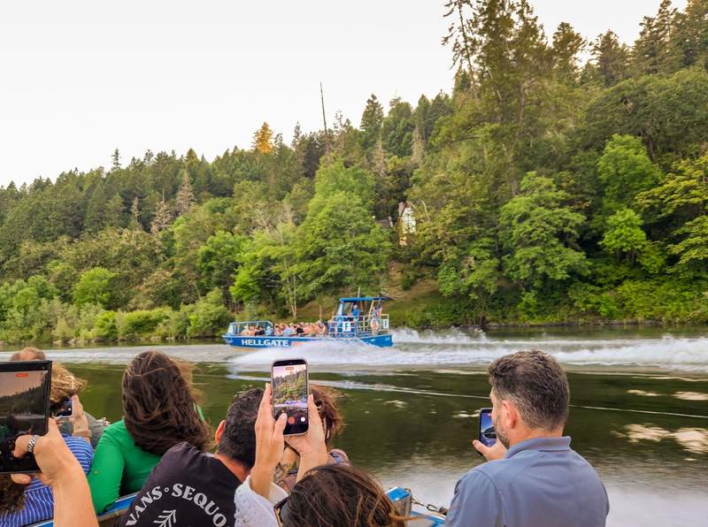 A Hellgate Jetboat speeding down the Rogue River on a Grants Pass weekend getaway