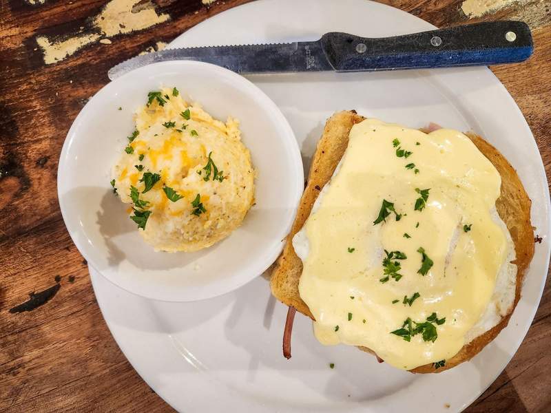 Savory breakfast sandwich with hollandaise sauce at Lulu's restaurant