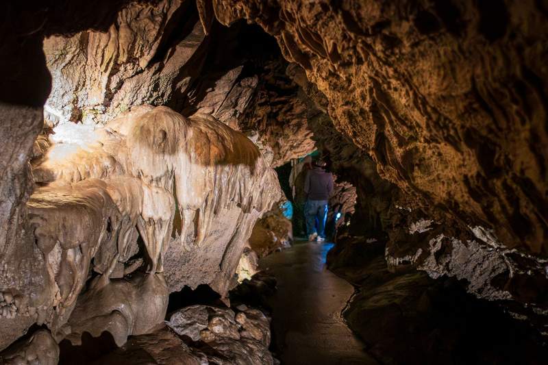 Illuminated rock formations inside the Oregon Caves National Monument 