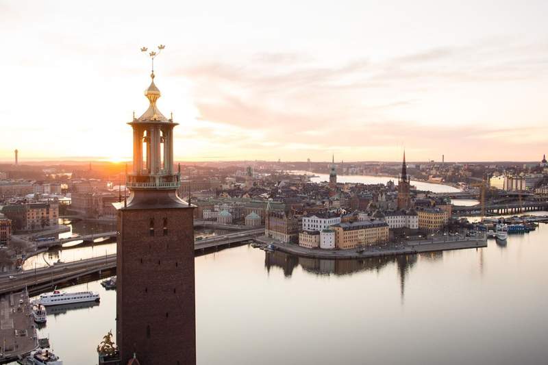 Stockholm City Hall rising above the waterfront with the Old Town in view.