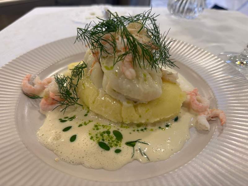 Fresh fish topped with shrimp at Lilla Brasseriet in Gothenburg’s Stora Saluhallen.