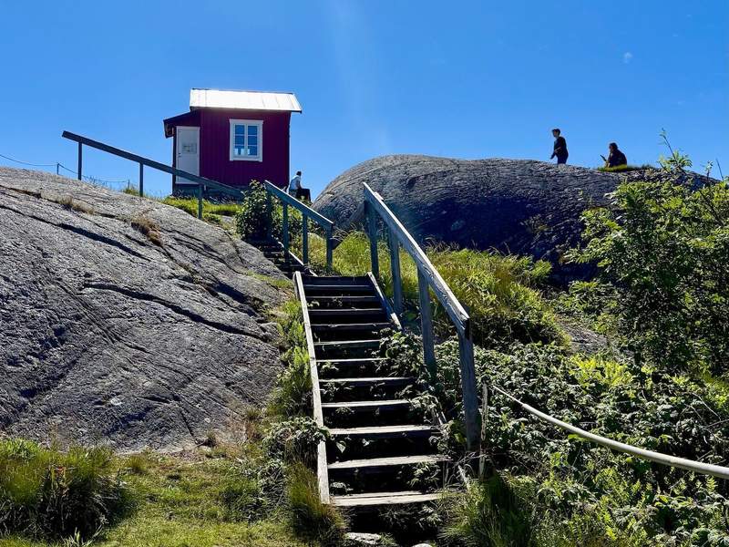  Wooden steps lead  toward the red pilot house high above Vrångö Island. 