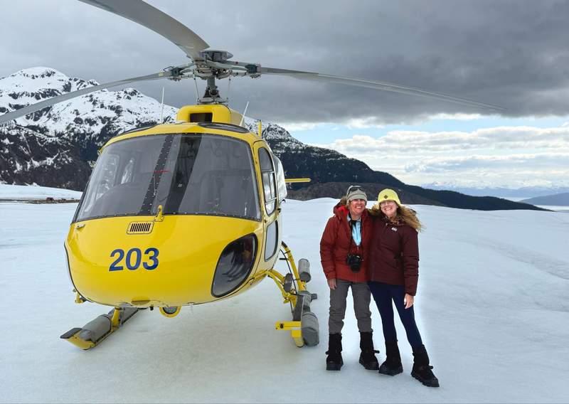 Mimi and daughter Megan walking on ancient blue ice during a Coastal Helicopters excursion to Herbert Glacier on the Juneau Icefield.