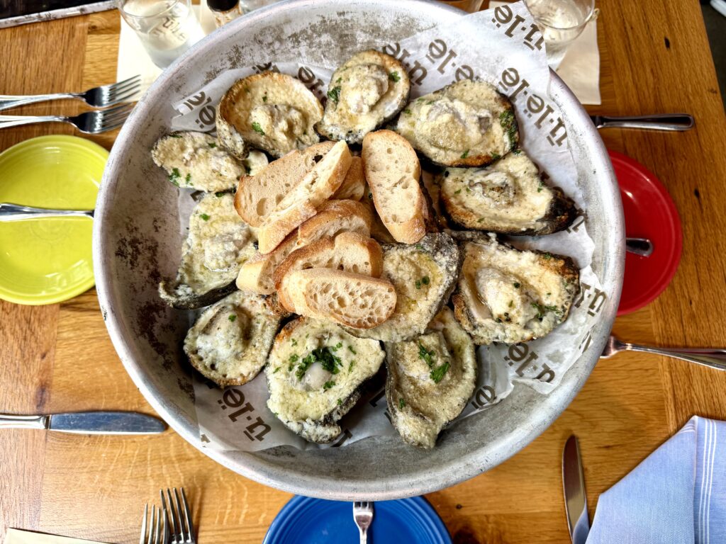 Plate of broiled oysters at Ulele, a fine dining restaurant in Tampa Florida