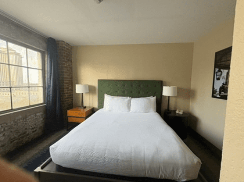 A modern room with exposed brick at The Mercantile Hotel in New Orleans.