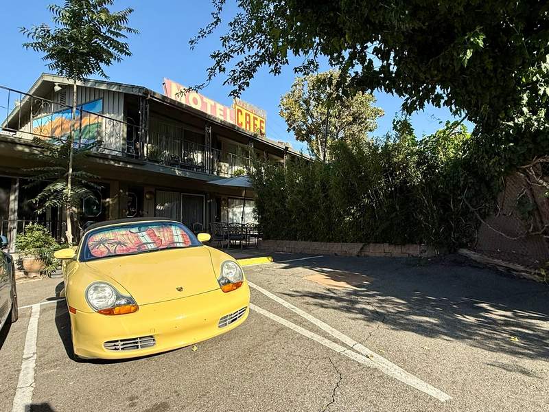 A fancy car parked in front of Piazza’s Pine Cone Inn in Kern, California.