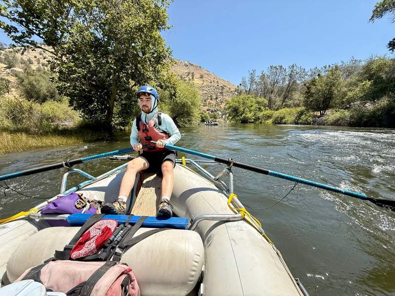 Author’s son in the guide position steering the raft.