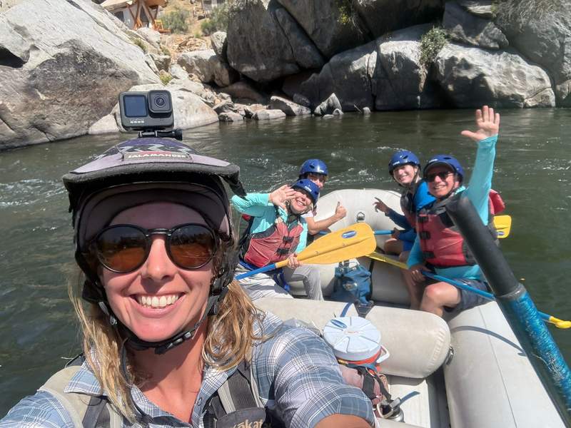 Selfie of author’s family and river guide on the river.