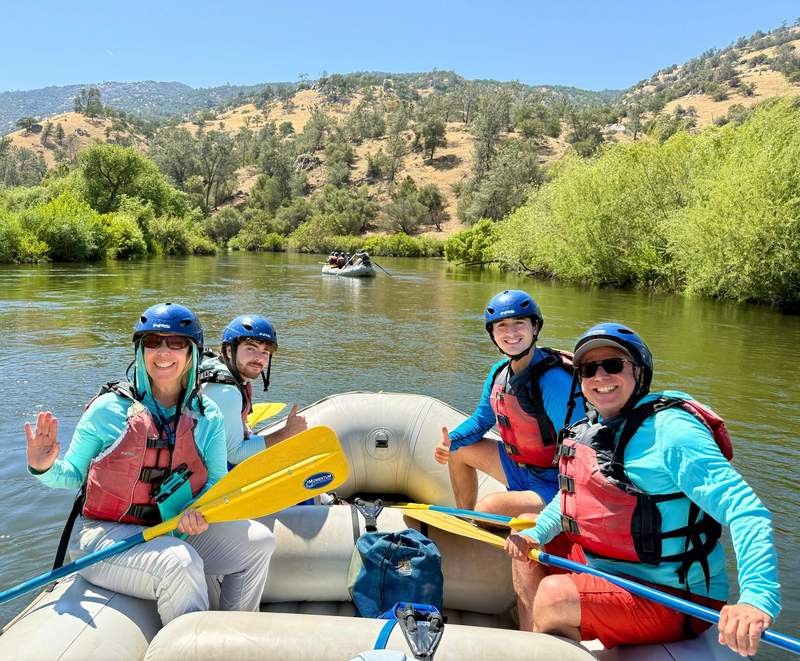 Author’s family and friend posing for photo in raft on the Kern River.