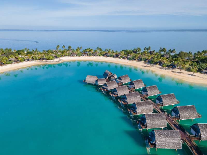 Bungalows in a lagoon surrounded by beach