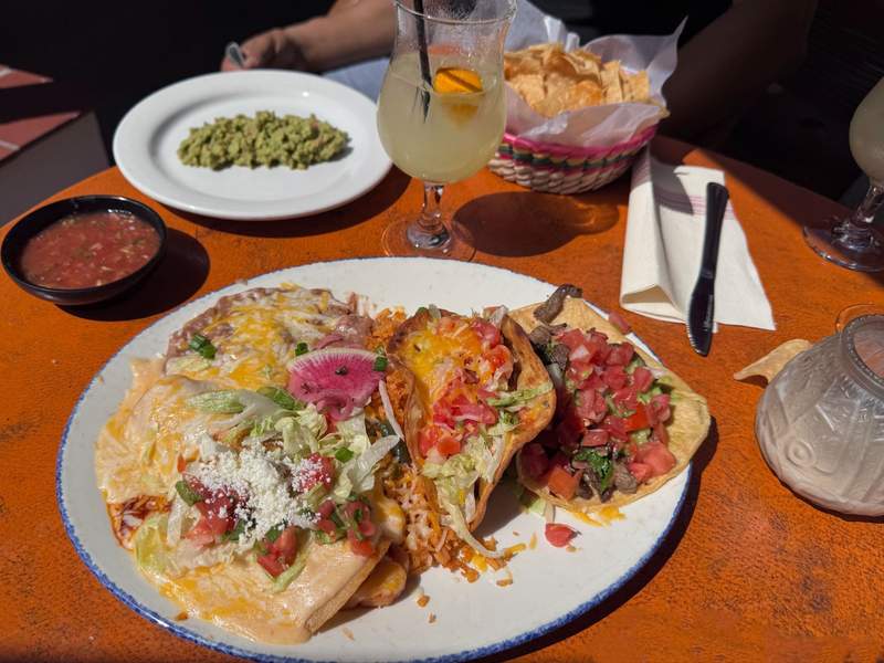 A plate of chicken quesadillas, rice and beans in a Mexican restaurant.